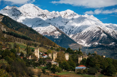 Scenic view of village against mountains