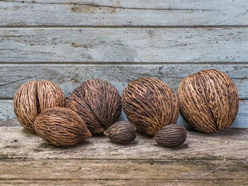 Close-up of coconuts on wooden table