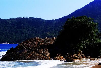 Scenic view of sea against clear sky during winter