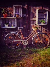 Bicycle parked against building