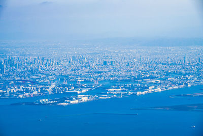 Aerial view of cityscape against sky