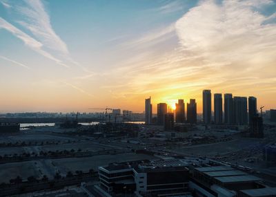 High angle view of buildings against sky during sunset