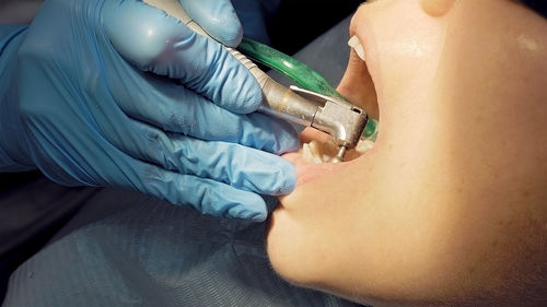 Dentist examining patient