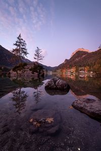 Scenic view of lake and mountains against sky