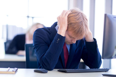 Midsection of person working on table