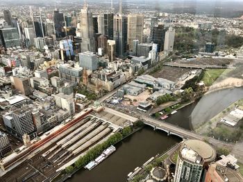 High angle view of river amidst buildings in city