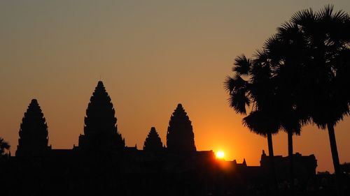 Silhouette of temple against sky during sunset