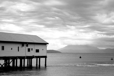 House by sea against sky