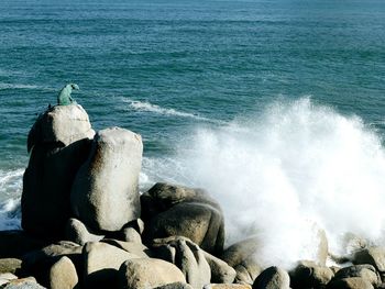 Waves breaking on rocks at shore