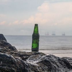 Scenic view of sea and rocks against sky