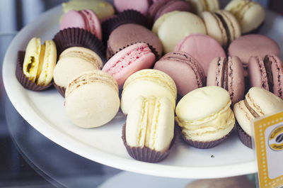 Close-up of macaroons in plate at store for sale