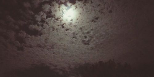 Low angle view of illuminated sky at night