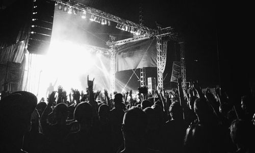 Rear view of people enjoying music concert