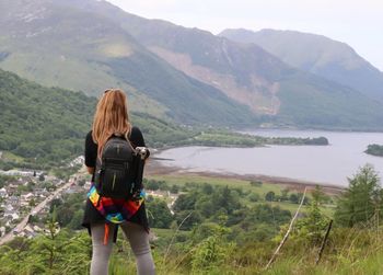 Rear view of woman looking at mountains