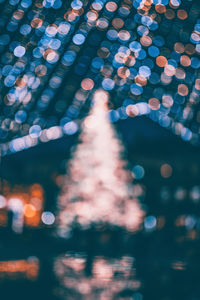 Defocused image of illuminated lights at night