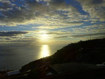 Scenic view of landscape against sky at sunset