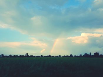 Scenic view of field against sky during sunset