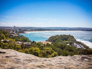 Scenic view of sea against blue sky