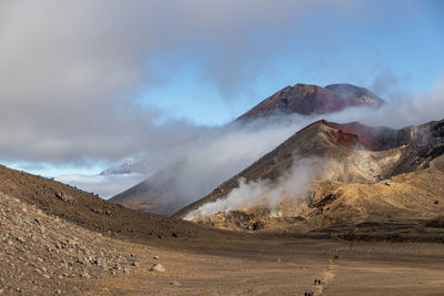 Scenic view of volcanic mountain against sky