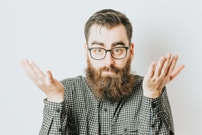 Portrait of young man against white background