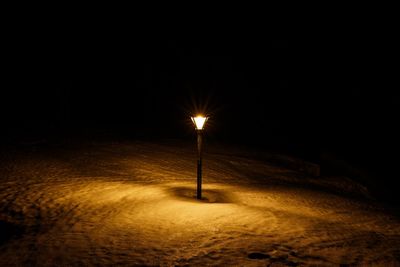 Illuminated street light at night