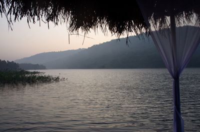 Scenic view of lake against sky during sunset