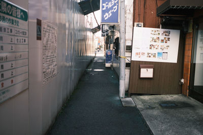 Empty alley amidst buildings in city