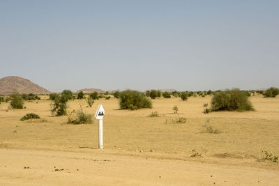 Scenic view of desert against clear sky