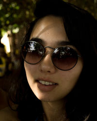 Portrait of woman in sunglasses outdoors