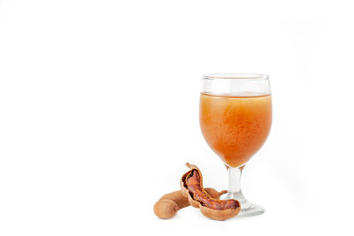 Close-up of beer glass against white background