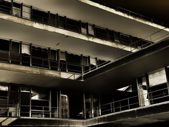 Low angle view of modern building against sky at night