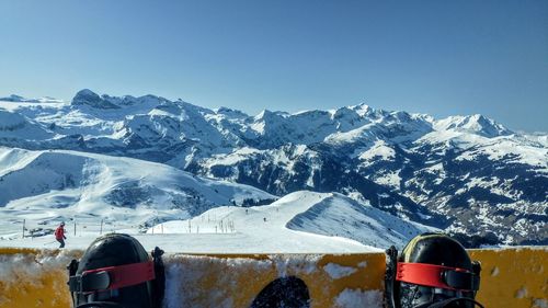 Cars on snowcapped mountain against sky