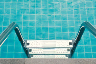 High angle view of ladder in swimming pool