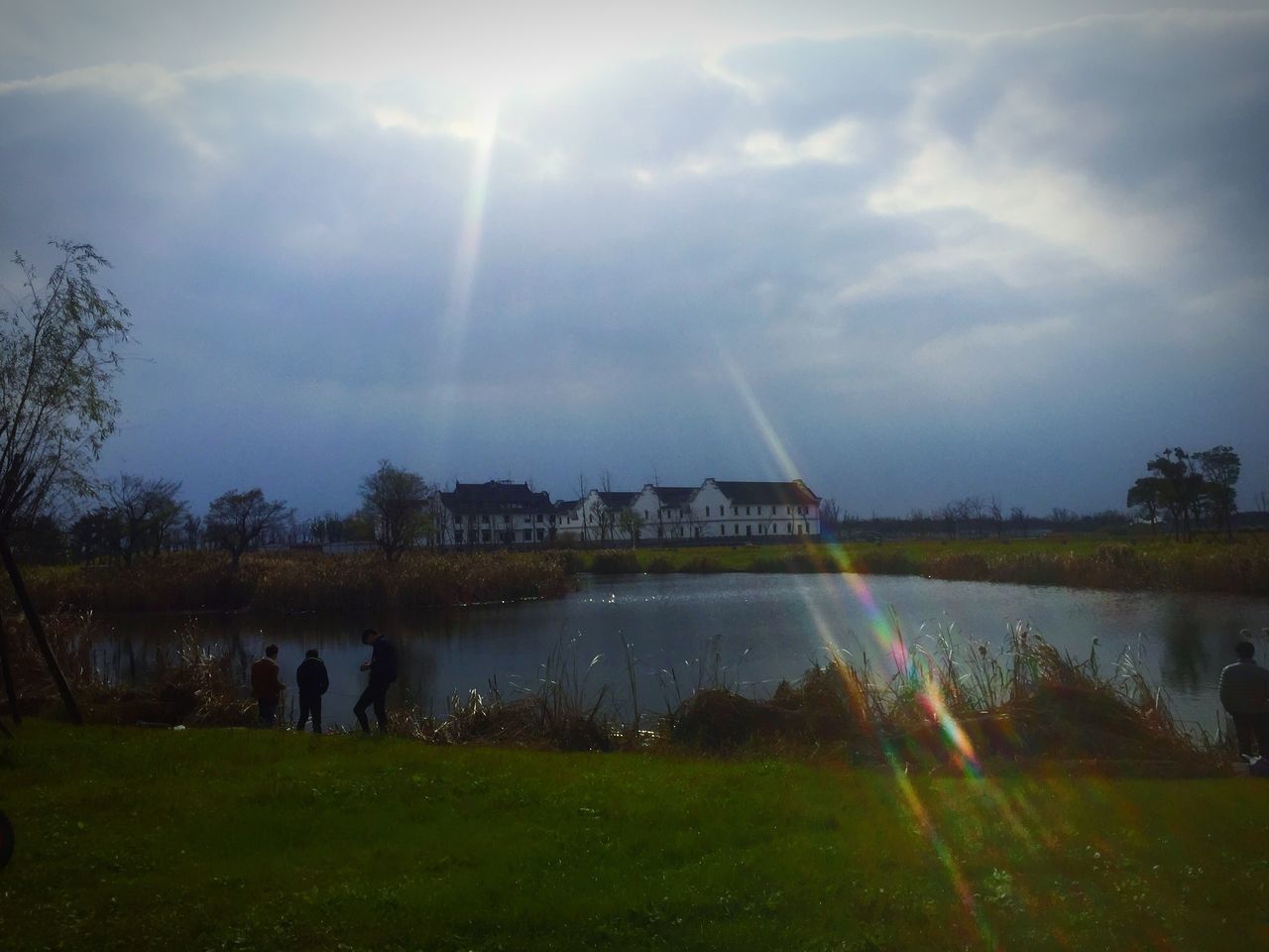 sky, real people, water, nature, tree, cloud - sky, men, outdoors, landscape, beauty in nature, day, people