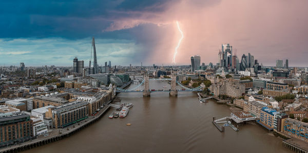 Lightening and thunderstorm in the middle of london near the tower bridge.