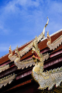 Low angle view of statue against building