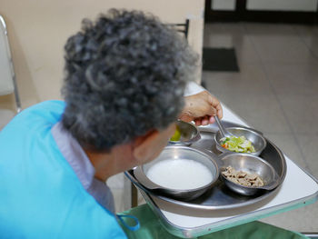 High angle view of patient having food