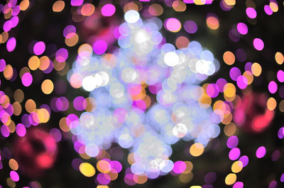 Defocused image of illuminated colorful background