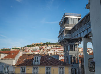 Buildings in city against sky