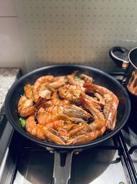 High angle view of meat in cooking pan