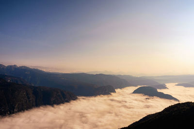 Scenic view of mountains against sky during sunrise