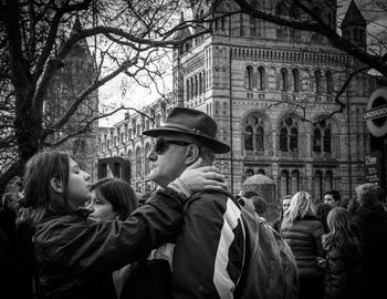 Bare trees in front of building