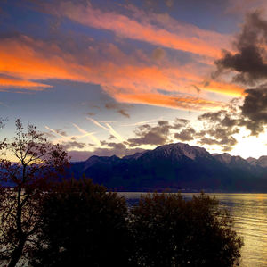 Scenic view of lake against orange sky