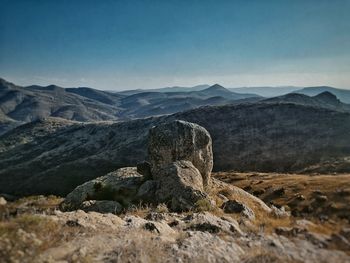 View of rock on land against sky