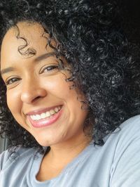 Close-up portrait of a smiling young woman