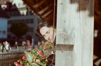 Woman looking at flower pot