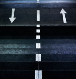 High angle view of arrow sign on road