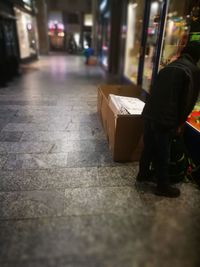 Close-up of man on street at night