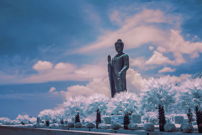 Statue against sky during winter