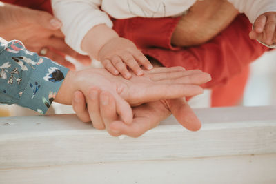 Close-up of people on table